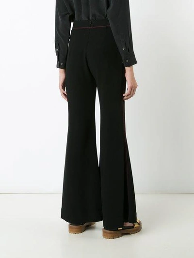 Shop Ellery Flared Stitched Trousers In Black