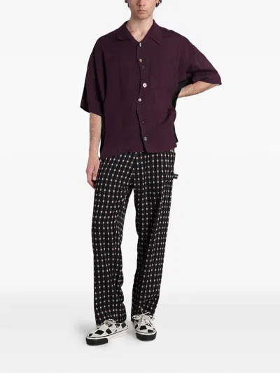 Undercover Check-pattern Logo-patch Trousers In Black