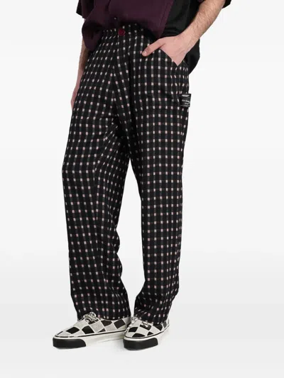 Undercover Check-pattern Logo-patch Trousers In Black