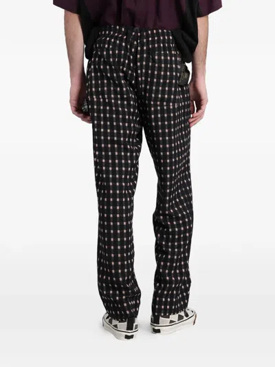 Undercover Check-pattern Logo-patch Trousers In Black