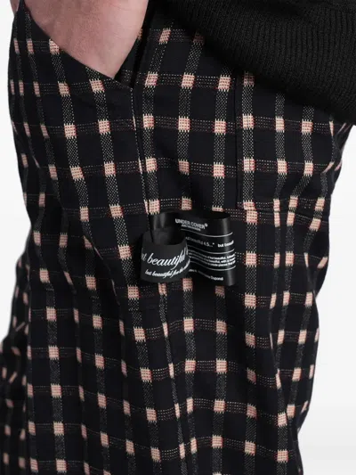 Undercover Check-pattern Logo-patch Trousers In Black