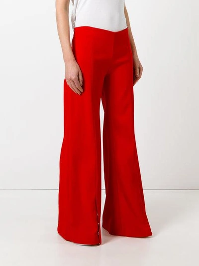 Shop Mugler Flared Trousers In Red