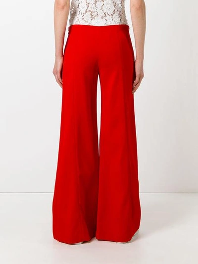 Shop Mugler Flared Trousers In Red