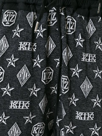 Shop Ktz Monogram Harem Trousers In Black