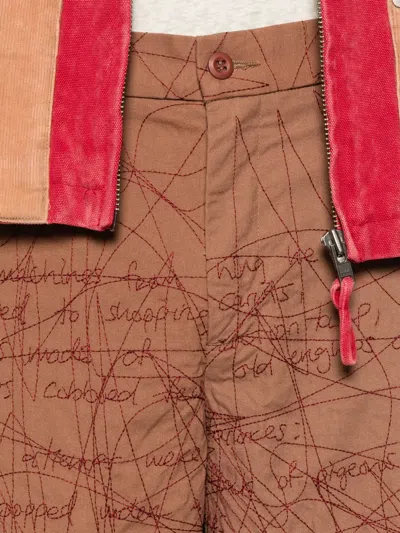 Kidsuper Embroidered Scribble-pattern Trousers In Brown