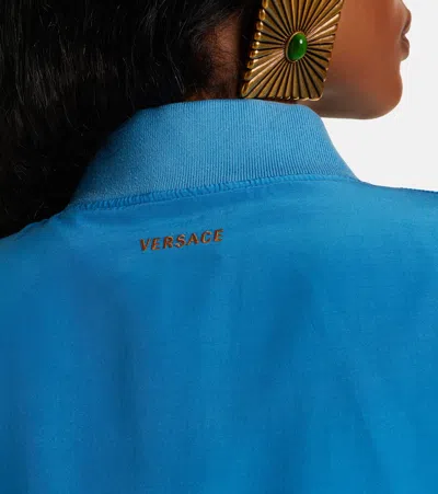 Versace Relaxed Fit Silk Jacket With Embroidered Logo And Zipper Closure In Blue