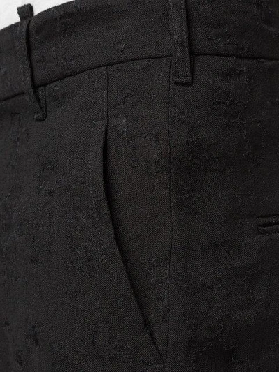 Shop Ann Demeulemeester Shredded Texture Trousers - Black