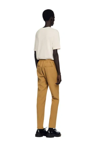 Sandro Jersey Trousers In Orange