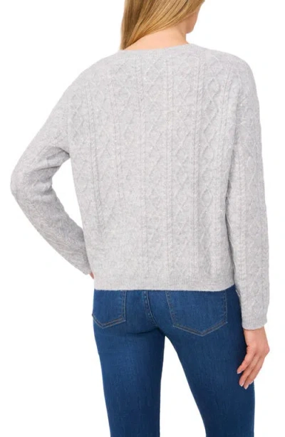 Cece Sequin Cable Stitch Sweater In Silver