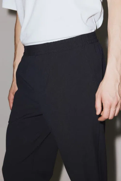H&m Four-way Stretch Regular-fit Pull-on Pants In Black