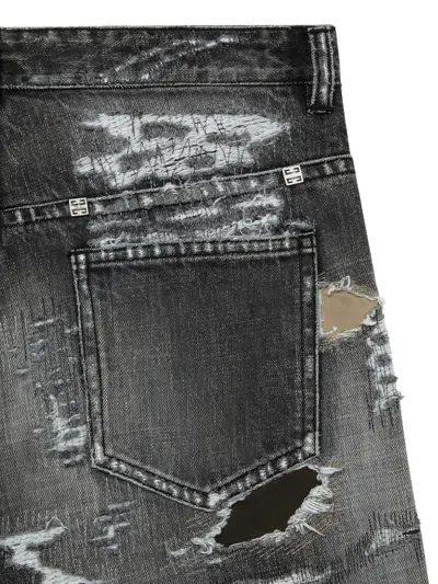 Givenchy Distressed Patched Jeans In Blue