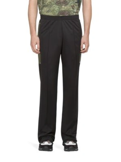 Shop Givenchy Solid Jogger Trousers In Black