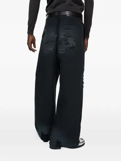Acne Studios Mended Distressed Trousers In Black