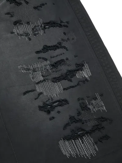 Acne Studios Mended Distressed Trousers In Black