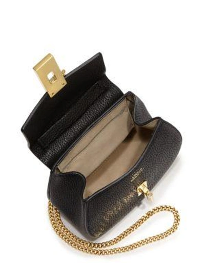 Shop Chloé Drew Nano Leather Saddle Crossbody Bag In Black