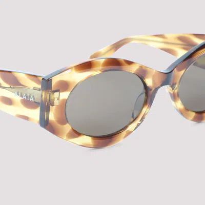 Alaïa Acetate Oval Frame Patterned Sunglasses In Gold