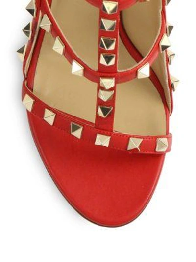 Shop Valentino Rockstud Leather T-strap Sandals In Nero