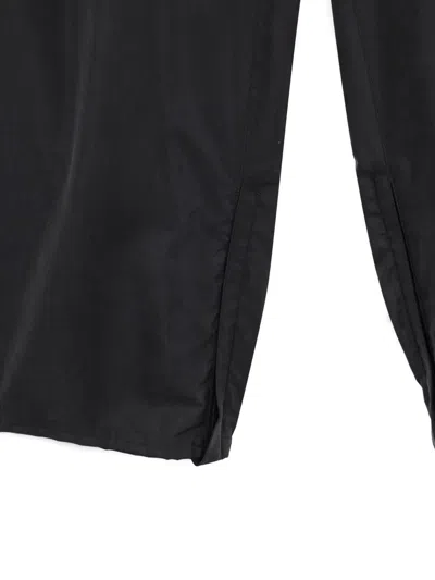 Ssstein Elasticated Zip-cuff Trousers In Black