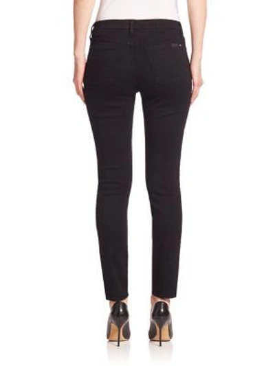 Shop Jen7 Riche Touch Mid-rise Skinny Jeans In Black