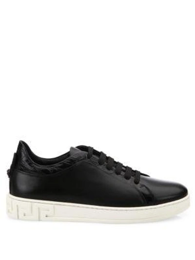 Shop Versace Grecca Leather Sneakers In Black