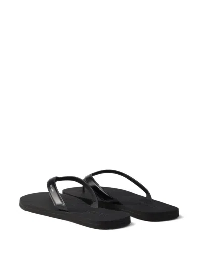 Prada Logo Embossed Leather Flip Flop Sandals In Black