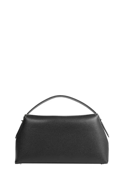 Totême Structured Black Leather Shoulder Bag With Flap Closure