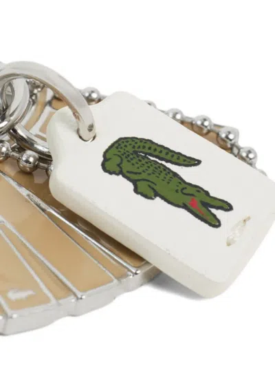 Lacoste Lenglen Charm Keyring In Metallic
