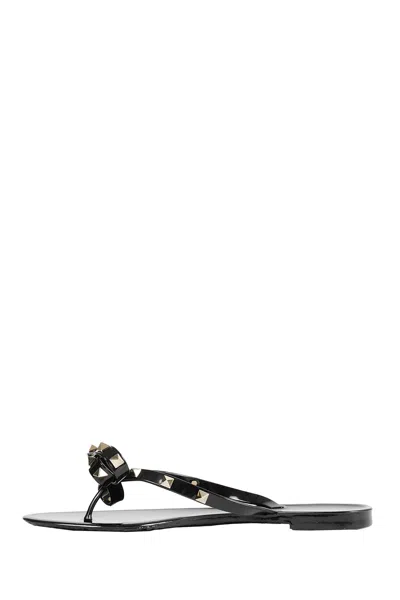 Valentino Garavani Mini Bow Sandals With Platinum-finish Studs In Black