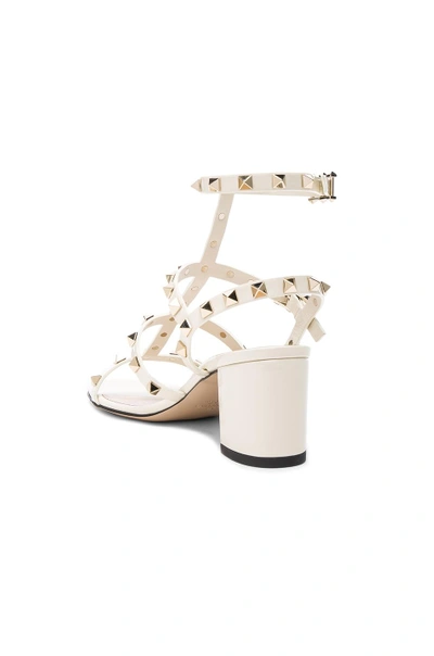 Shop Valentino Patent Leather Rockstud Sandals In Light Ivory