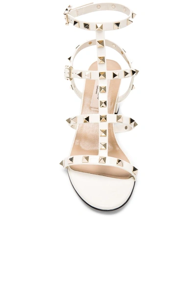 Shop Valentino Patent Leather Rockstud Sandals In Light Ivory