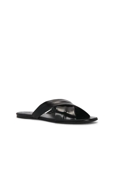 Khaite Liria Glossed-leather Sandals In Black