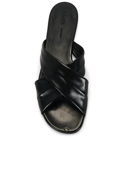 Khaite Liria Glossed-leather Sandals In Black
