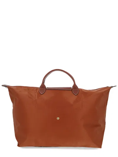 Longchamp Foldable Rectangular Travel Bag Top Handles In Brown