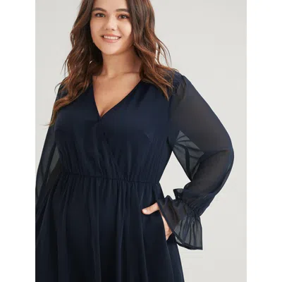 Bloomchic Women's Plus Size Solid Button Split Pocket Wrap Lantern Sleeve Ruffles Hem Dress Darkblue Solid Dai In Blue
