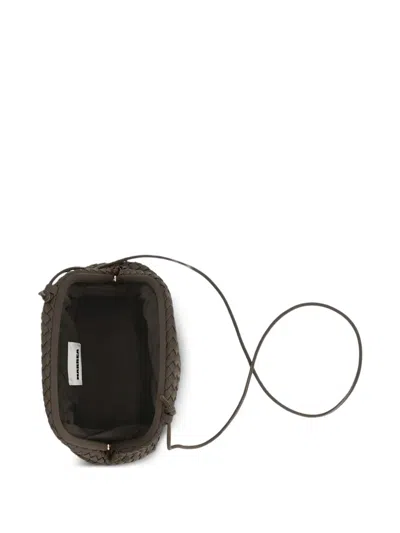 Marrea Woven Drawstring Clutch Bag In Brown