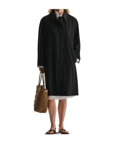 The Row Long-sleeved Coat In Black