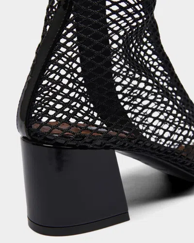 Alaïa Fishnet Patent Leather-trimmed Ankle Boots In Black