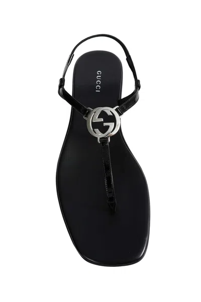 Gucci Interlocking G Leather Thong Sandals In Black