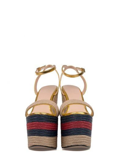 Shop Gucci Metallized Gold Leather Wedge Sandal