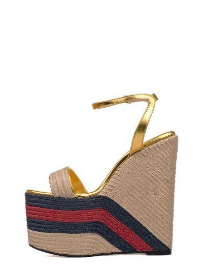 Shop Gucci Metallized Gold Leather Wedge Sandal