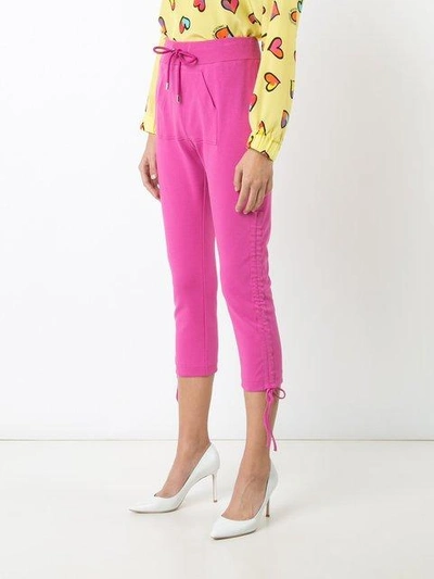 Shop Moschino Cropped Drawstring Pull Trousers - Pink