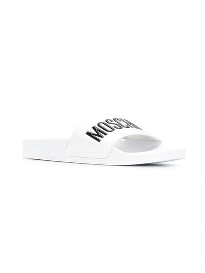 Shop Moschino Logo Sliders In White