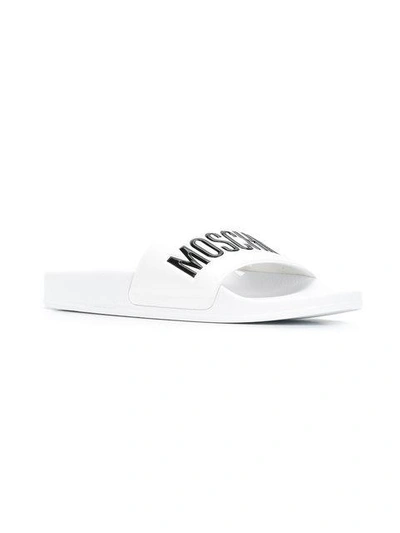 Moschino Embossed Logo Pool Slides In White