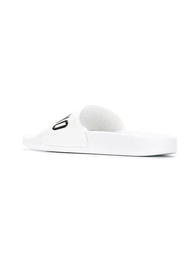 Moschino Embossed Logo Pool Slides In White