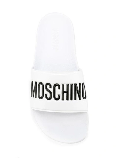 Shop Moschino Logo Sliders In White