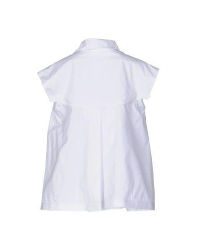 Shop Alaïa Solid Color Shirts & Blouses In White