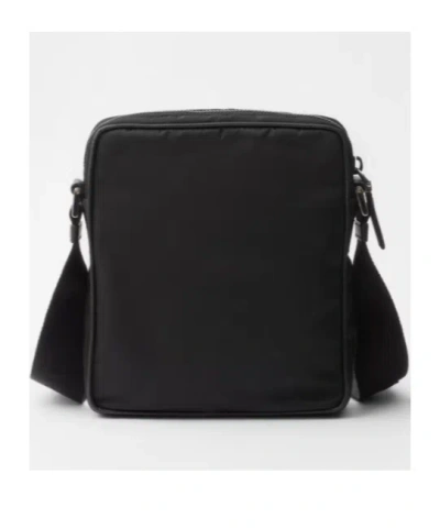 Prada Triangle-logo Messenger Bag In Black