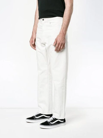 Shop Raf Simons Straight Bleached Jeans In White