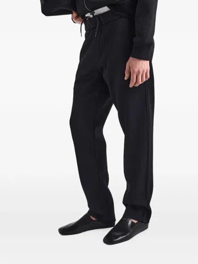 Prada Technical Jersey Pants In Black
