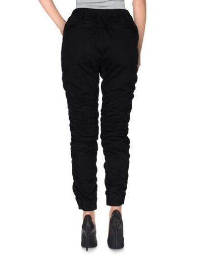 Shop White Mountaineering Casual Pants In Black